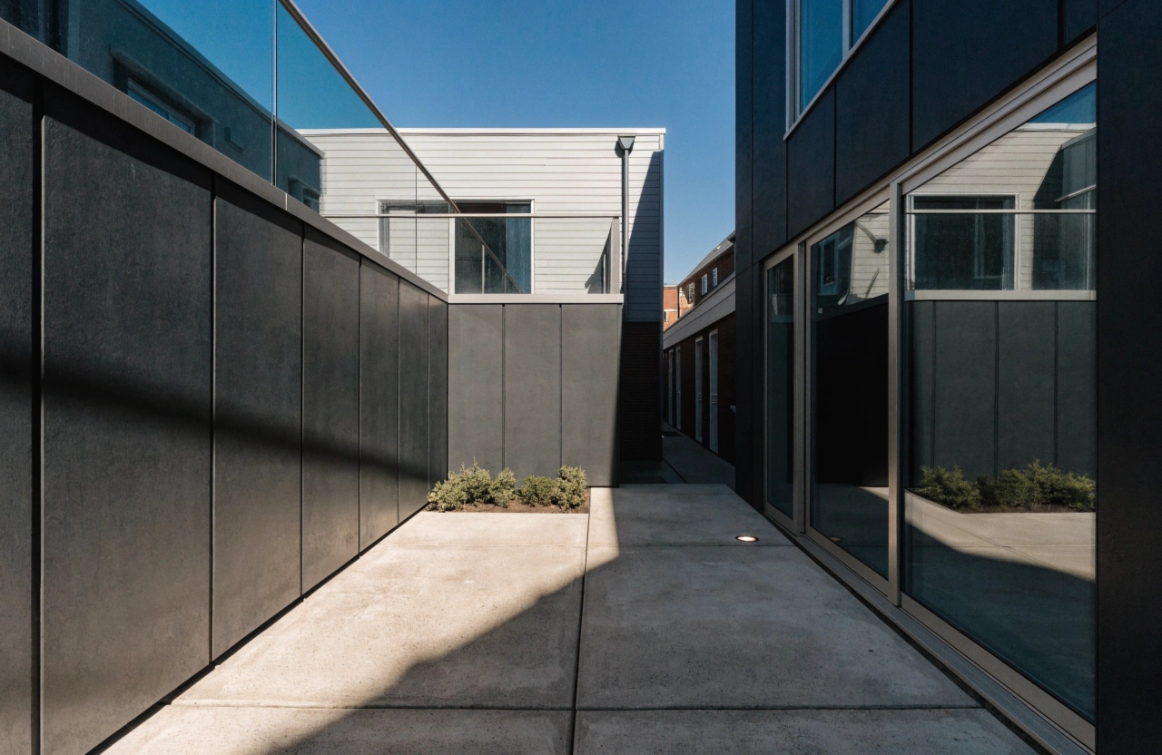 Concrete courtyard slab at a Turner townhouse with tight side access