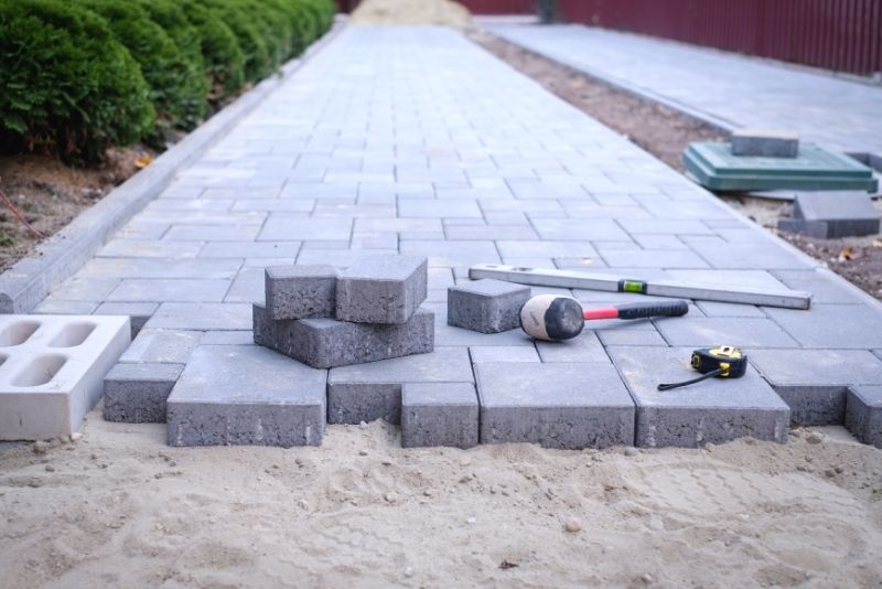 A pavement being installed using concrete blocks