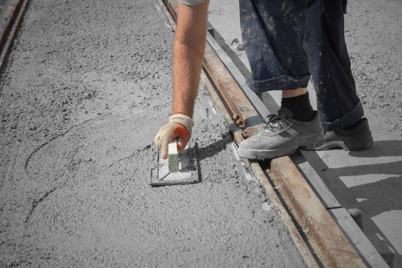 Concrete being laid on a surface
