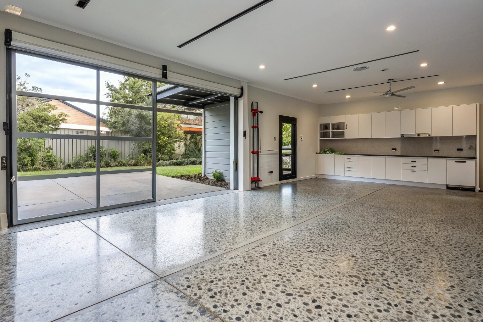 Decorative exposed aggregate garage slab providing durable and attractive flooring solution